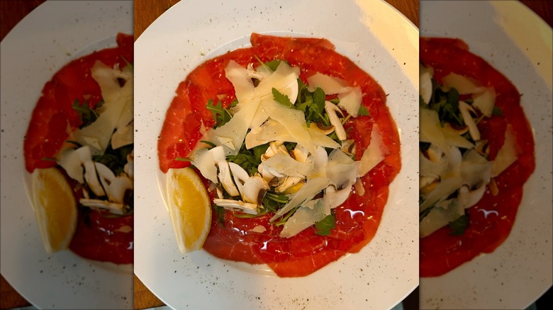 Plate of Italian food with cheese/lemon