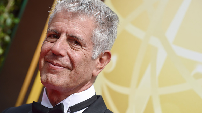 Anthony Bourdain wearing tuxedo smiling