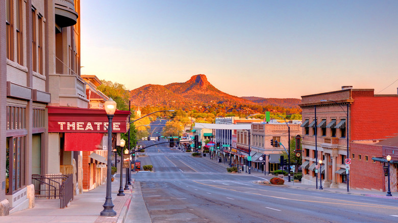 Downtown Prescott with the sun shining on a nearby butte