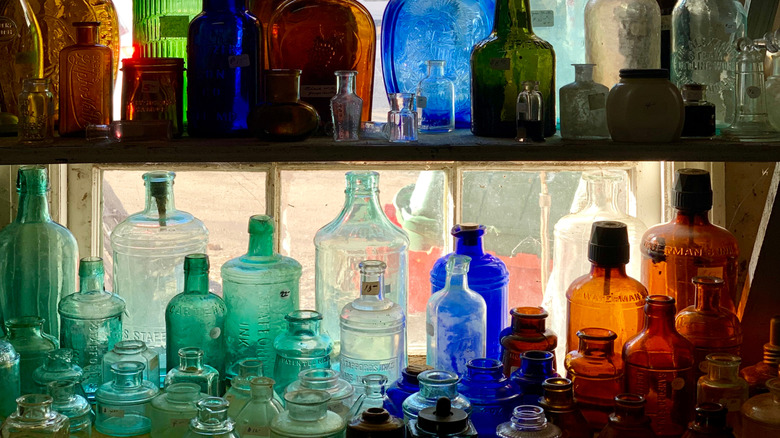 Colorful vintage bottles for sale in a shop in Millerton