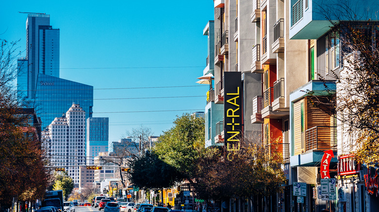 The streets of East Austin, Texas, with a view of downtown's skyscrapers