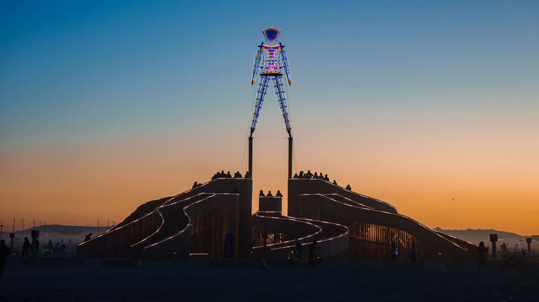 Burning Man statue at twilight in the Nevada desert