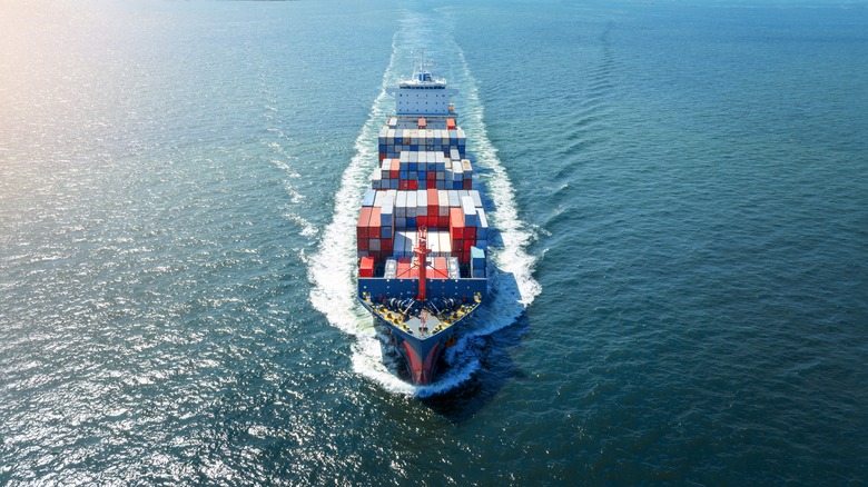 A cargo ship cruising through the sea