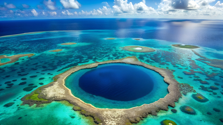 Great Blue Hole in Belize with clouds and sky in the background