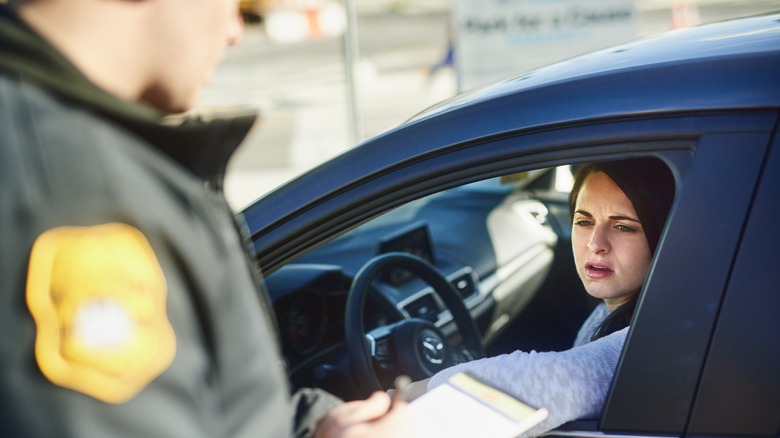 Police officer issuing a speeding ticket