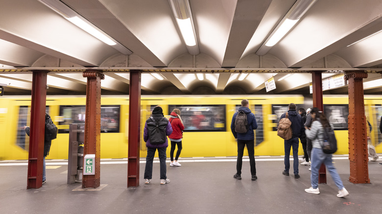 People waiting at the Alexanderplatz U-Bahn station in Germany