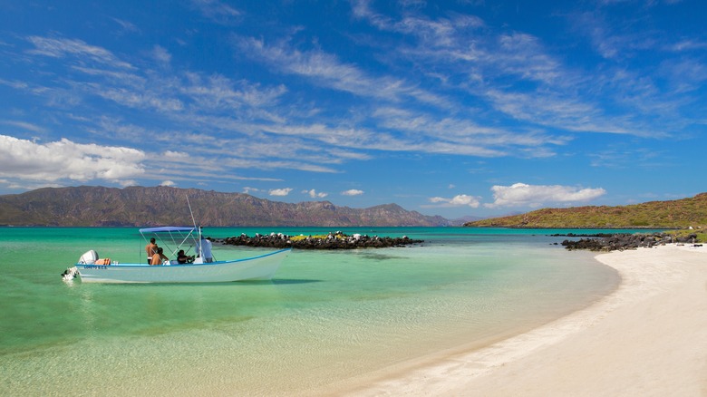 A white-sand beach with boat