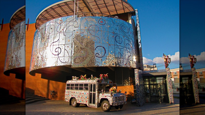 Exterior of the American Visionary Art Museum with a decorated bus parked out front