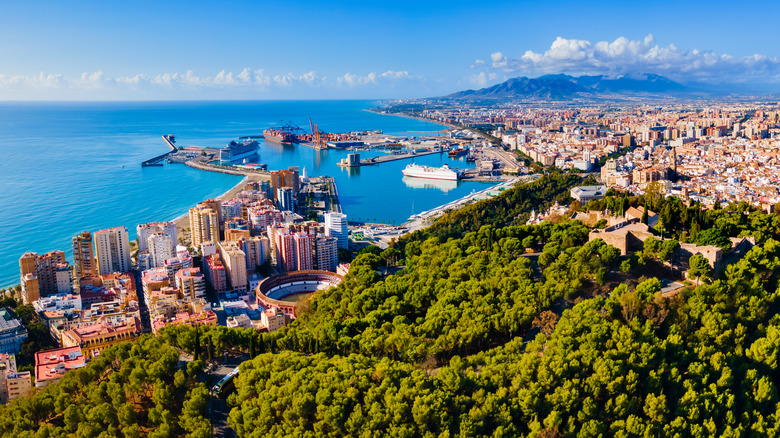 Panoramic views of beach and port city.