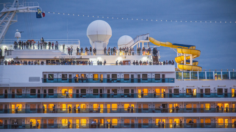 People on cruise ship at dusk