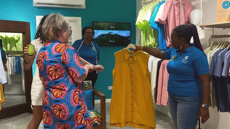 Bequia Threadworks employees showing garment