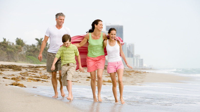 family walking on beach