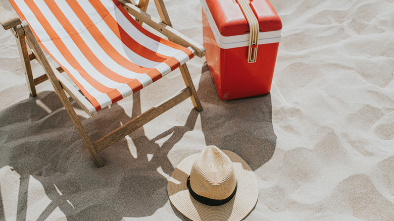 chair, hat, cooler on beach