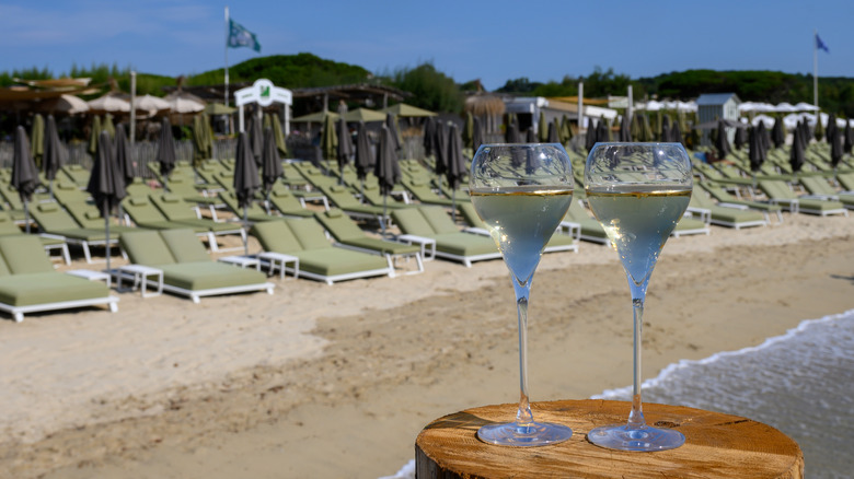 drinks near green beach chairs