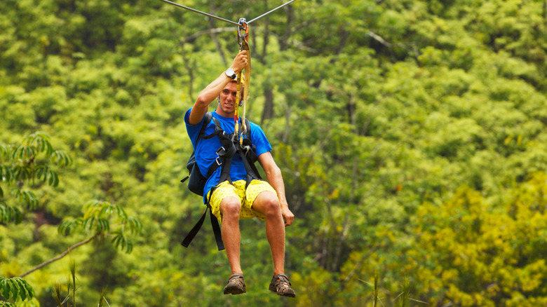 young man ziplining