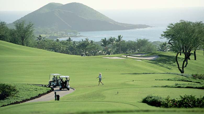 people golfing on Wailea course