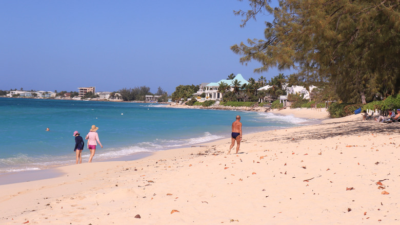 people strolling Seven Mile Beach