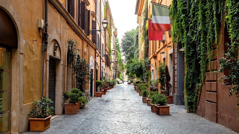 An Italian flag hangs on a building on Via Margutta in Rome