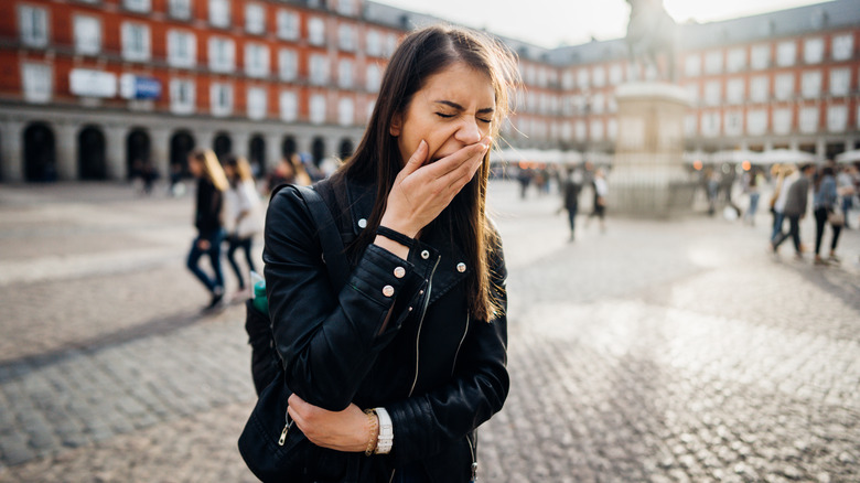 Woman yawning in Madrid