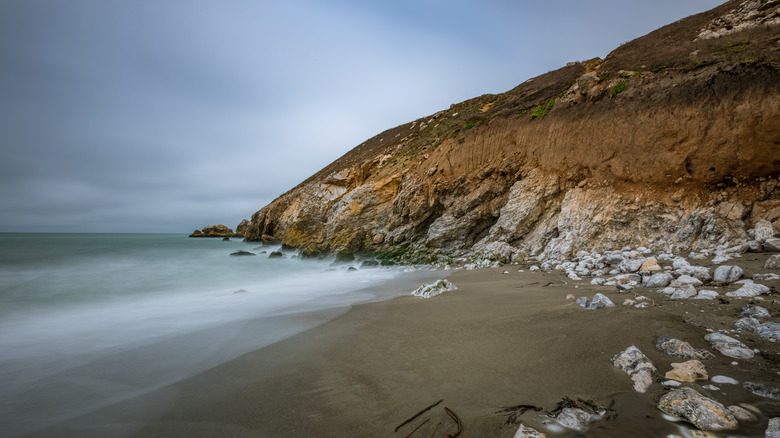 Ocean cove with brown sand