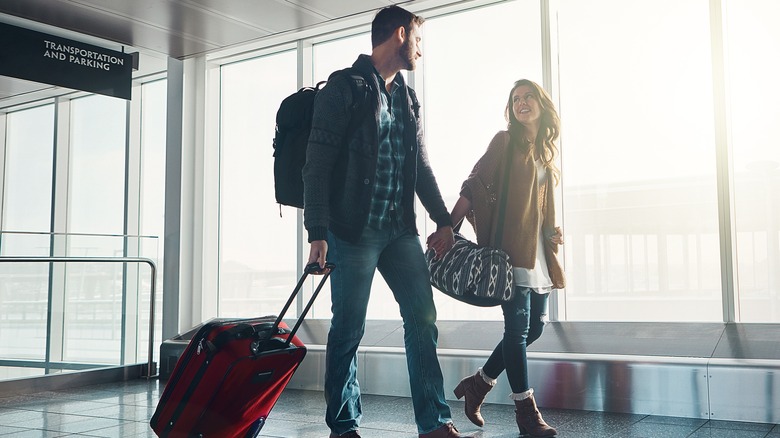 A couple walking in an airport