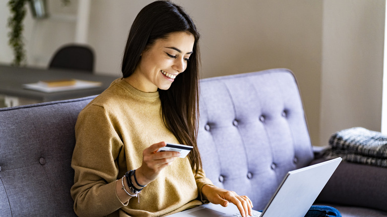 Woman entering her credit card details