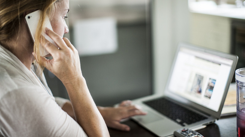 Woman on phone with customer service