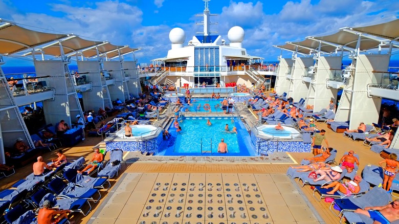 Travelers on cruise's pool deck