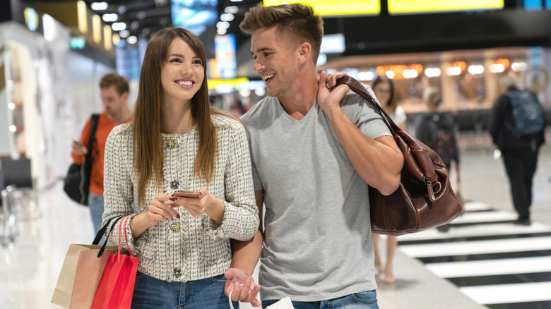 Couple shopping in an airport