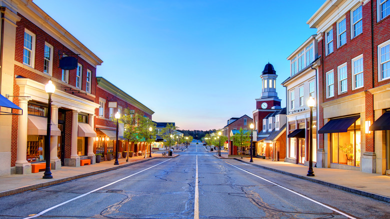 Mashpee Commons' Main Street at sunset, lined with shops