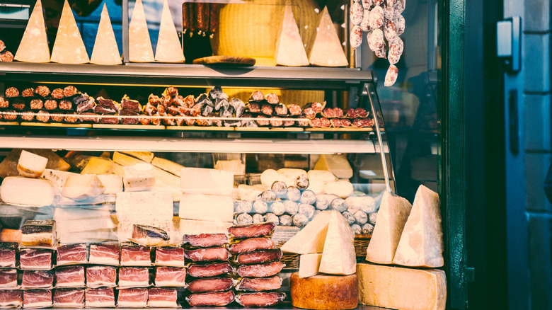 An Italian market with fresh meats and cheeses