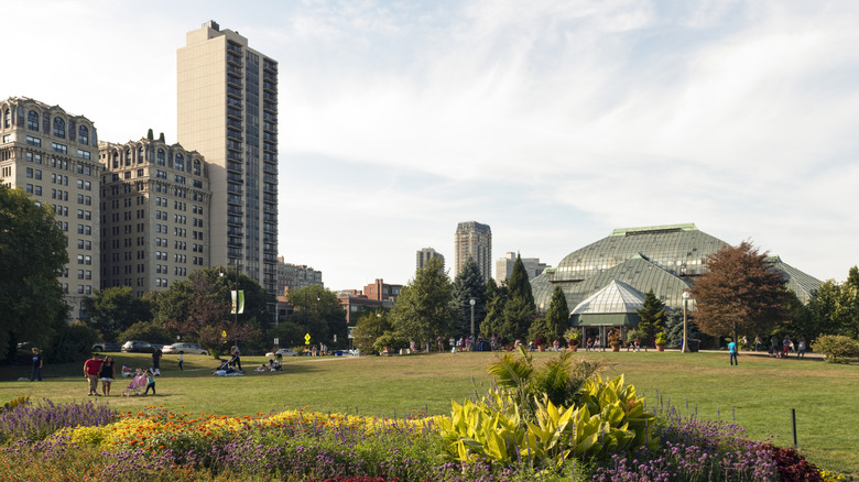 Chicago's Lincoln Park Conservatory with skyscrapers and gardens nearby