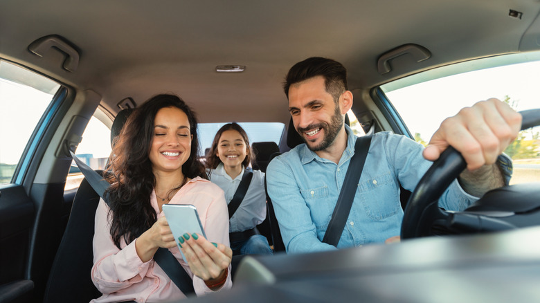 Couple using gps travel app