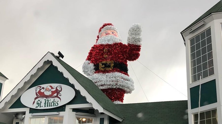 Santa statue on top of St. Nick's in Littleton, Colorado