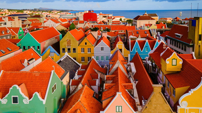 Red roofs of Punda contrast with the pastel-hued facades and the blue waters of Curaçao's harbor