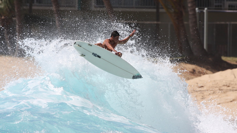 A surfer surfs in Hawaii