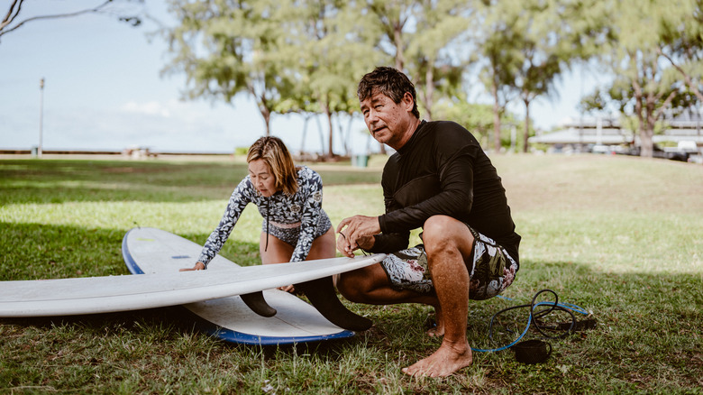 Hawaiians working on surfboards