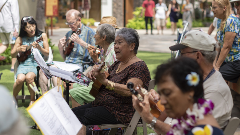 People playing instruments and singing in Waikiki