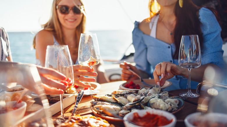 Friends enjoying a meal on a cruise