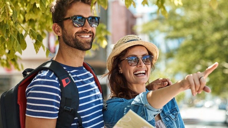 Happy couple looking at a map