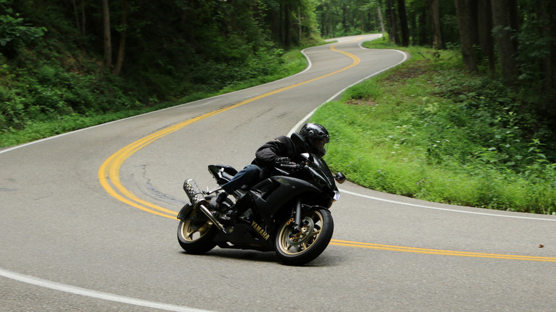 Motorcyclist speeding along Tail of the Dragon road