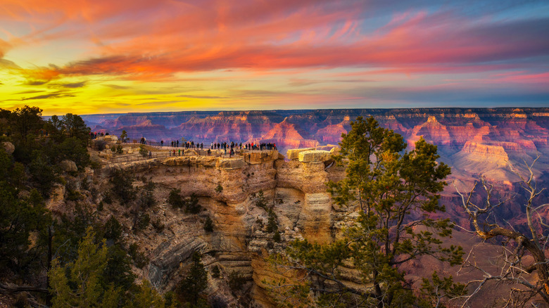 Visitors at Mather Point in Grand Canyon National Park at sunset