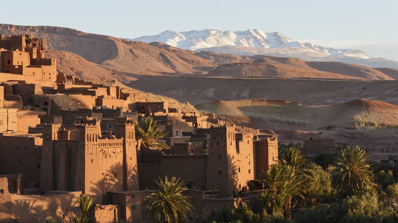 Atlas Mountain range behind a Moroccan town at sunset