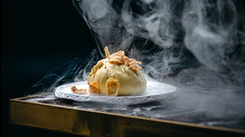 A steaming hot plate of food, ready for guests at the Dans le Noir ? restaurant in Paris