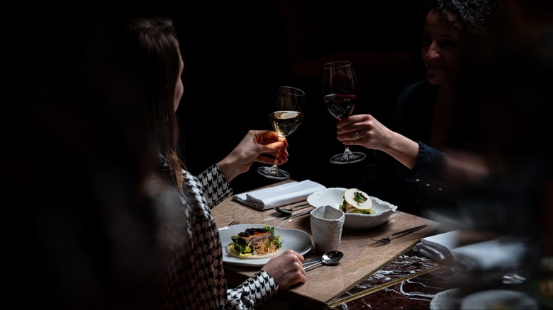 Diners enjoying their meal at Dans le Noir ? restaurant in Paris