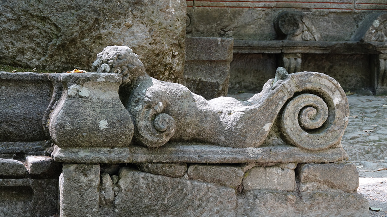 Strange sculpture lying on bench