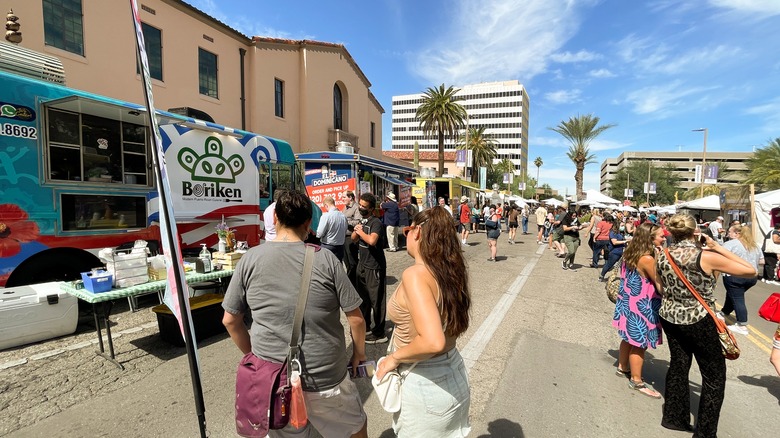 A group of people in line for food vendors at Meet Yourself Tucson