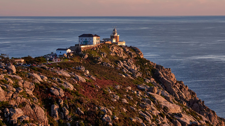 Sunset over the Fisterra lighthouse in Galicia, Spain