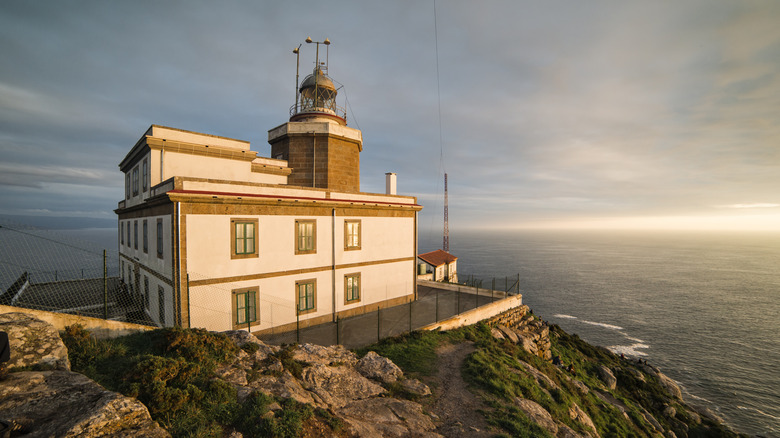 The Cape Finisterre Lighthouse standing over the sea in Galicia, Spain