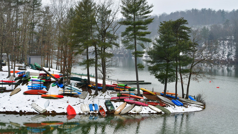 Colorful canoes and kayaks lying by a lake in Basye, Virginia